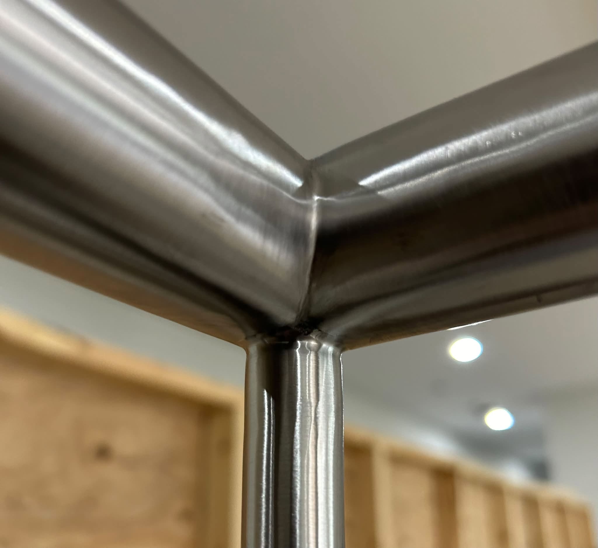 Stainless railing junction with blended welds